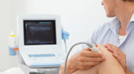 female patient's knee joint dynamic test carried out with the use of an ultrasound